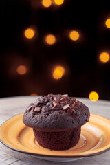 delicious chocolate cake on a yellow plate