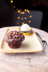 delicious chocolate cake and ice cream on a yellow plate