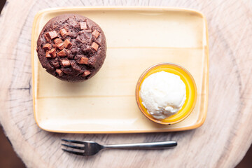 delicious chocolate cake and ice cream on a yellow plate