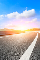 Asphalt road and mountain at sunset.Road and mountain background.