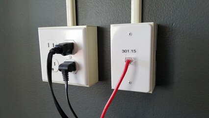 Power outlets and network outlet, connecting on concrete wall