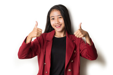 
Young asian woman smiling and making OK sign with hand gesture.