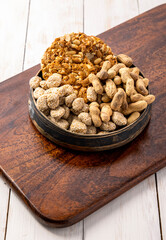 Sesame seed cake or candy, peanuts chikki with roasted peanuts for the celebration of Indian festival Lohri