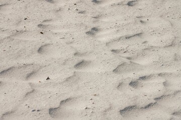 Patterns and footprints in the sand on Sanibel beach in Florida