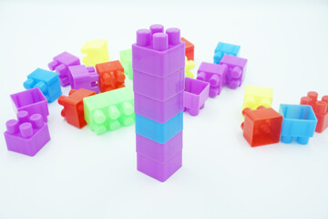 Fototapeta premium Colored stacking blocks on a white background