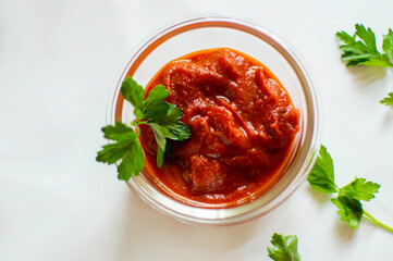 Tomato paste in a clear bowl