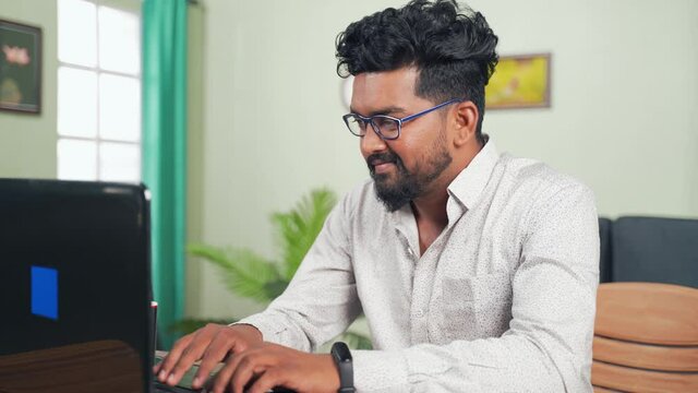 Young man reading Mail on laptop got overjoyed by good news by clenching fist at workplace - Concept of new Job offer or promotion, college admission and loan approvel