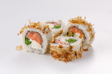 Sushi rolls with tuna shavings on a white plate. Isolated. Restaurant concept. Close-up.