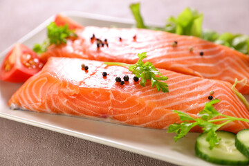 raw salmon fillet and herbs