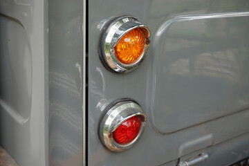 Detail RED tail light and turn signal old car.  classic Vintage car automobile.        