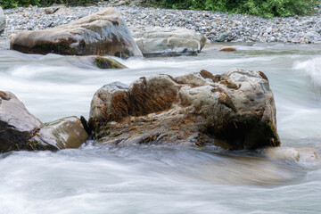 Naklejka na ściany i meble Rocky stream running water of mountain river