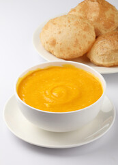 Indian Food - Aamras is a sweet dish made from the pulp of the Alphonso mango fruit. Served with hot puri/poori. Sweet Mango puree garnished with Kashmiri Saffron. Aam Ras Puri OR Alphonso Mango pulp