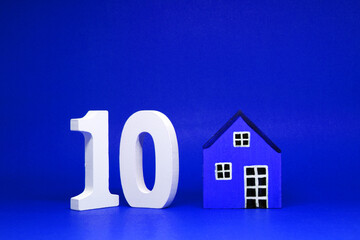 Fototapeta na wymiar Number 10 ( Ten ) with Home Blue Pattern with Copy Space - 10% Sale off or Discount Safe Price home property Business building finance Concept