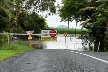 Warning sign road closed due to flooding.