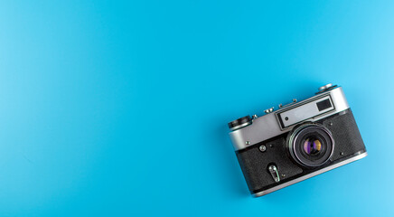 Old camera on a blue background