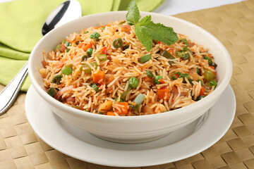 Veg Schezwan Fried Rice Vegetarian Szechuan Rice is indo-chinese cuisine dish with bell peppers, green beans, carrot.
