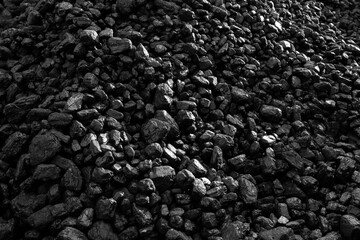 Coal stacked outdoors.  Fossil fuel concept. Textured background
