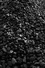 Coal stacked outdoors.  Fossil fuel concept. Textured background