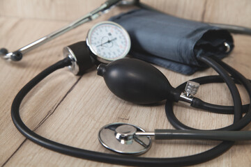 Pressure device on a wooden background.