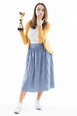 Young woman with a winning cup. Emotional portrait