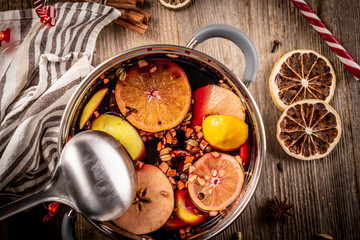 Pot with wine and spicy fruits