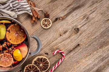 Pot with wine and spicy fruits