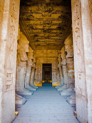 inside Abou Simbel rock temple of king Ramesses II with its statues corridor