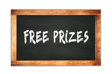 Fototapeta premium FREE PRIZES text written on wooden frame school blackboard.