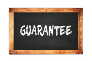 GUARANTEE text written on wooden frame school blackboard.