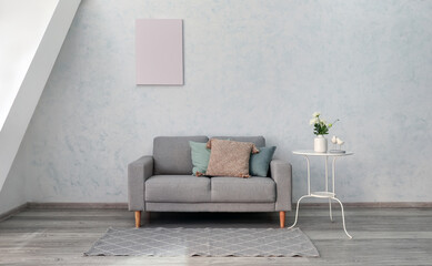 Stylish sofa in interior of living room