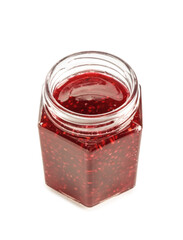 Jar with sweet raspberry jam on white background