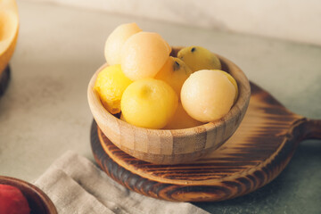Tasty watermelon balls in bowl on table