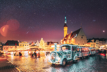 Tallinn, Estonia. Beautiful Train For Sightseeing Near Traditional Christmas Market On Town Hall...