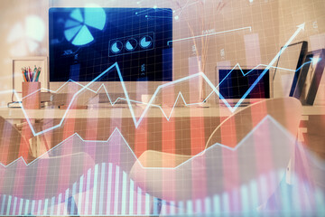 Double exposure of stock market graph drawing and office interior background. Concept of financial analysis.