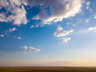 Blue sky and clouds with horizon on sunset