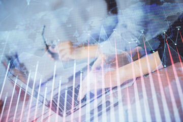 Multi exposure of woman hands typing on computer and financial chart hologram drawing. Stock market analysis concept.