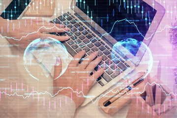 Double exposure of woman hands typing on computer and forex chart hologram drawing. Stock market analysis concept.