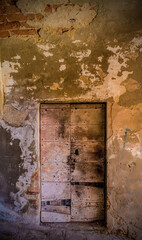 A door in a run down building in the historic medieval village of Scansano, Grosseto Province,...