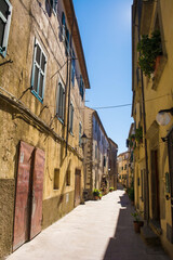 A quiet residential street in the historic medieval village of Scansano, Grosseto Province, Tuscany, Italy

