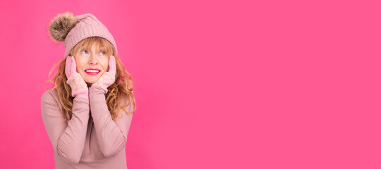 pensive adult woman wearing warm clothes isolated on background