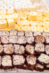 Traditional Turkish delight. Various pieces of arabic sweets or desserts for ramadan holiday