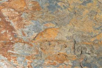 The texture of rough stone covered with rust as background