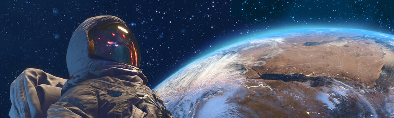 An astrounaut in outer space against the Earth on background