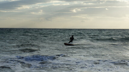 Fototapeta premium Kitesurfing in the windy sea near Athens Greece