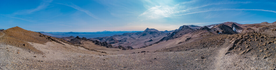 Panoramic view over Icelandic landscape of colorful volcanic caldera Askja, in the middle of volcanic desert in Highlands, with red, turquoise volcano soil and blue sky, Iceland