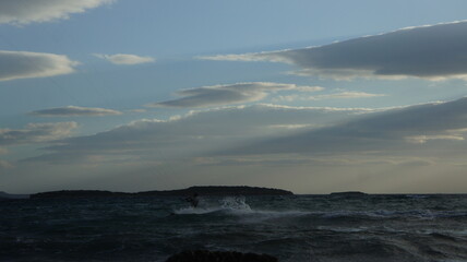 Fototapeta na wymiar Kitesurfing in the windy sea near Athens Greece