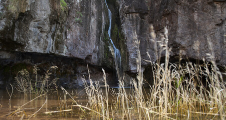 Gran Canaria, small freshwater pool in Tejeda municipality called Charco de la Paloma, ie Dove Pool water is running after winter rains

