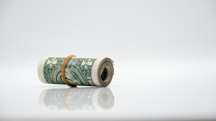 roll of dollar bills banknotes white background