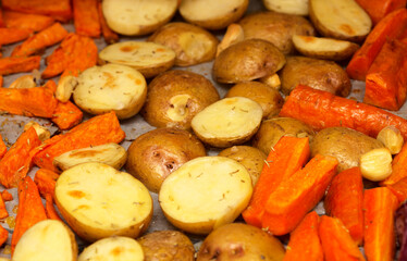 Winter comfort food - roasted root vegetables on a oven tray covered with parchment