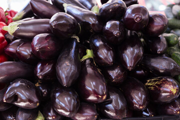 Fresh eggplant on market counter